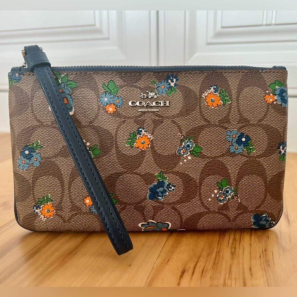 Coach Wristlet with Blue Leather Strap, Signature Monogram, and Floral Print